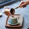 Pouring Specialty Turkish Coffee in to the Charcoal color porcelain Loveramics Bond Ibrik Cup